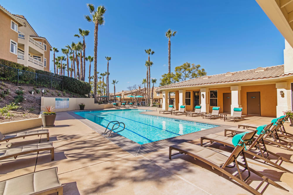 Chaise lounge chairs near the pool at Sofi Canyon Hills in San Diego, California