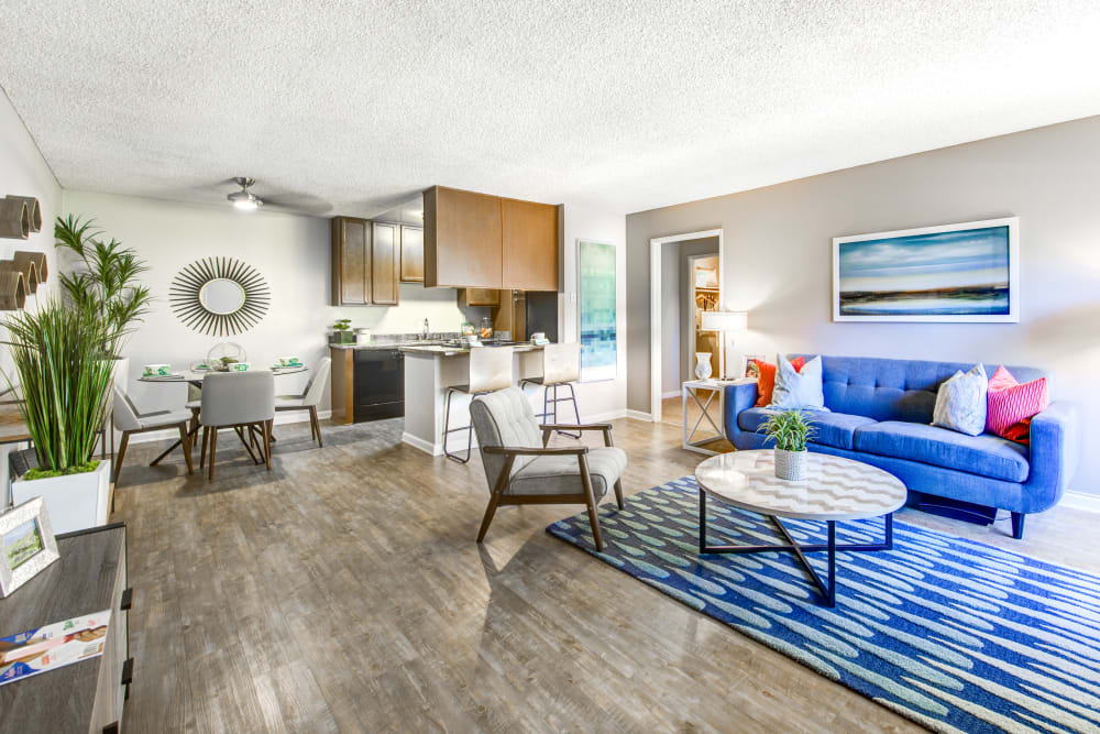 Spacious open-concept layout with beautiful hardwood floors in a model home at Sofi Poway in Poway, California