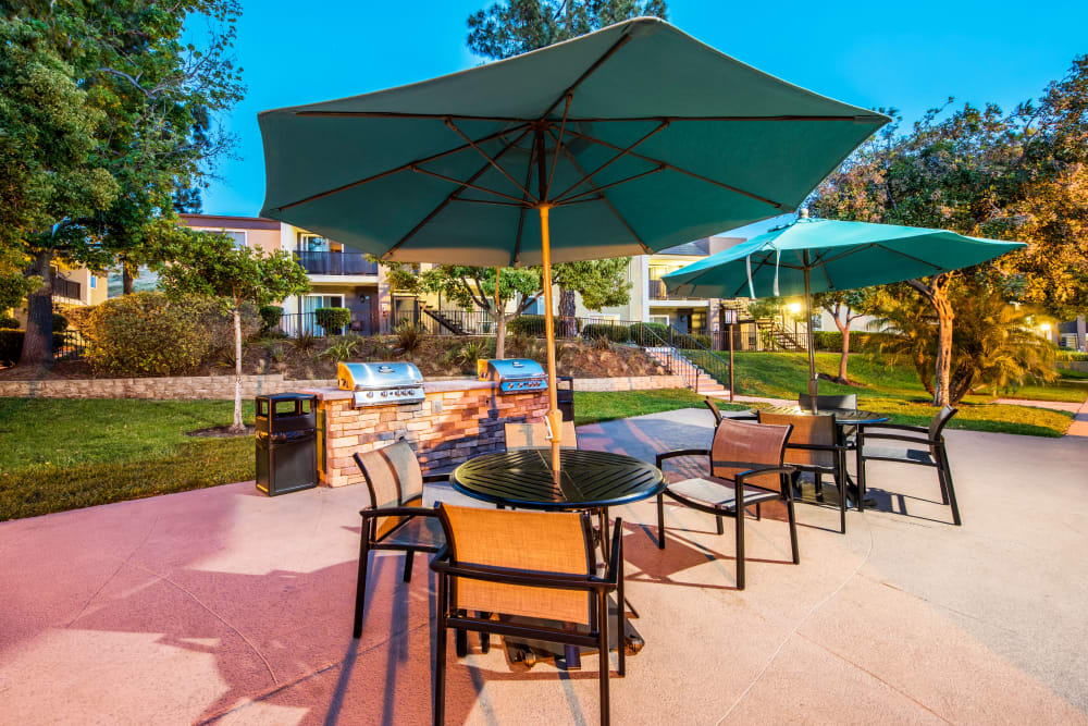 Barbecue area with gas grills at dusk at Sofi Poway in Poway, California