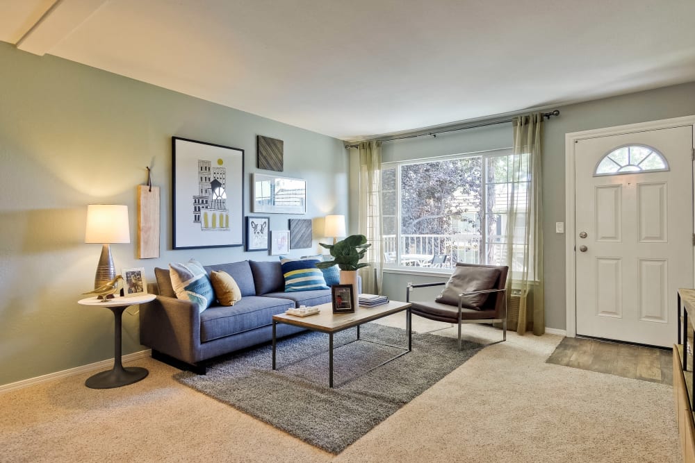 Comfortably decorated model home's living room at Sofi at Los Gatos Creek in San Jose, California