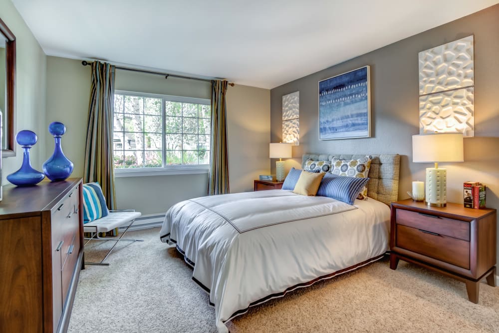 Nicely furnished master bedroom in a model home at Sofi at Los Gatos Creek in San Jose, California