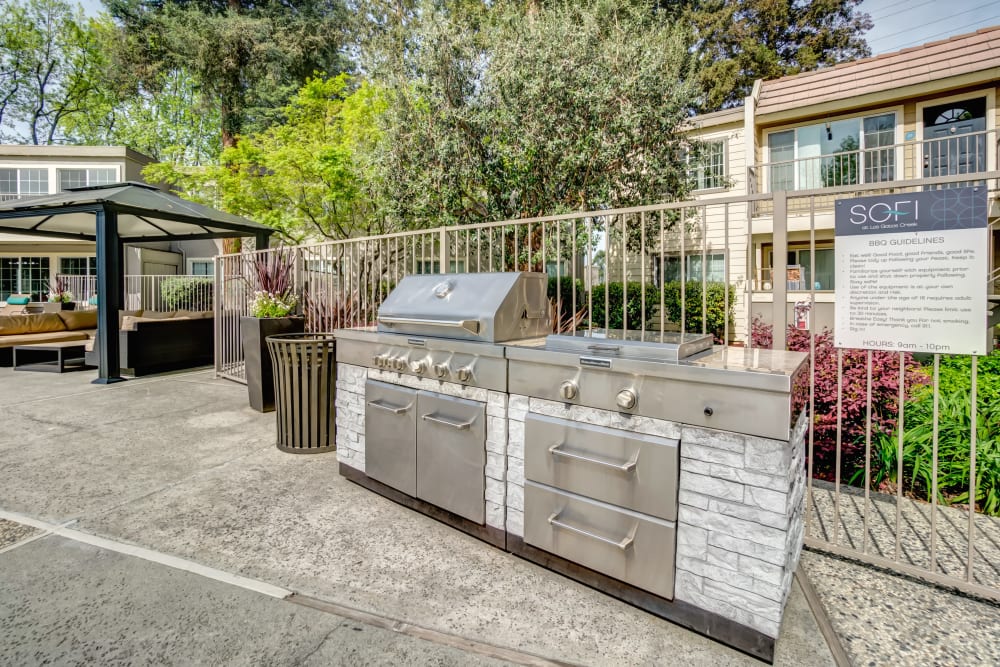 Barbecue area with gas grills at Sofi at Los Gatos Creek in San Jose, California