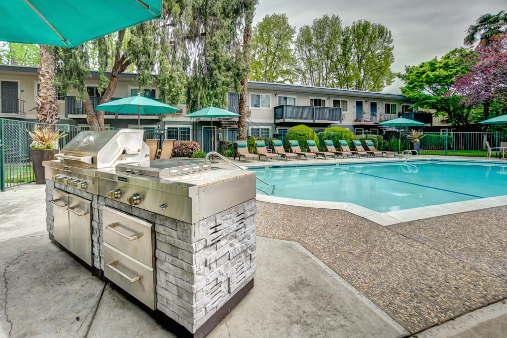 Barbecue grills near the swimming pool at Sofi at Los Gatos Creek in San Jose, California