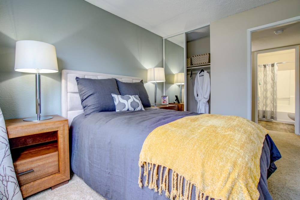 Master bedroom with an en suite bathroom in a model home at Vue Fremont in Fremont, California