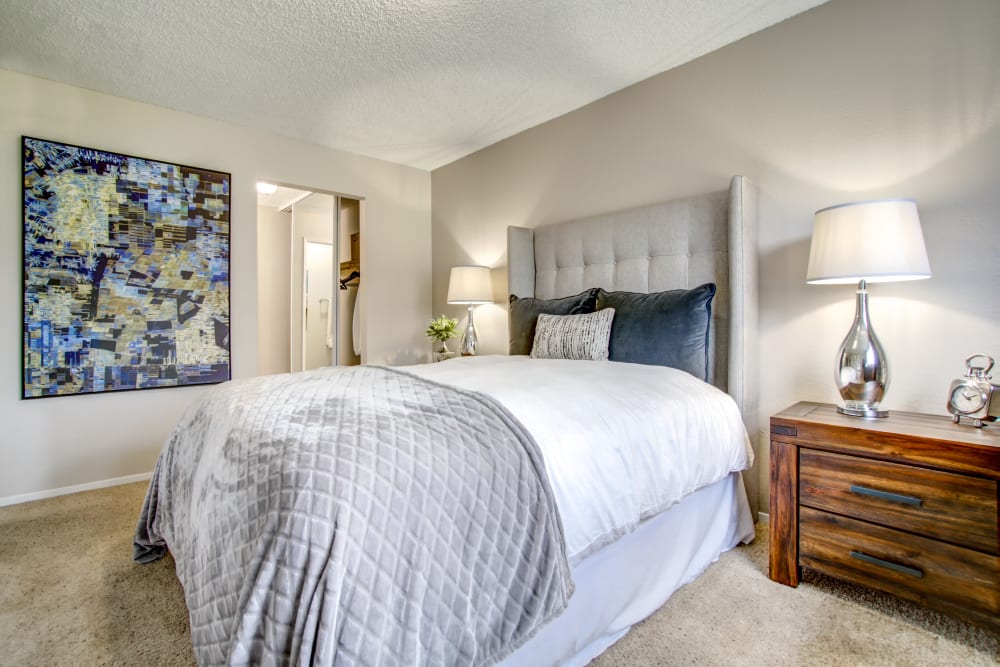 Plush carpeting in the well-furnished bedroom of a model home at Vue Fremont in Fremont, California