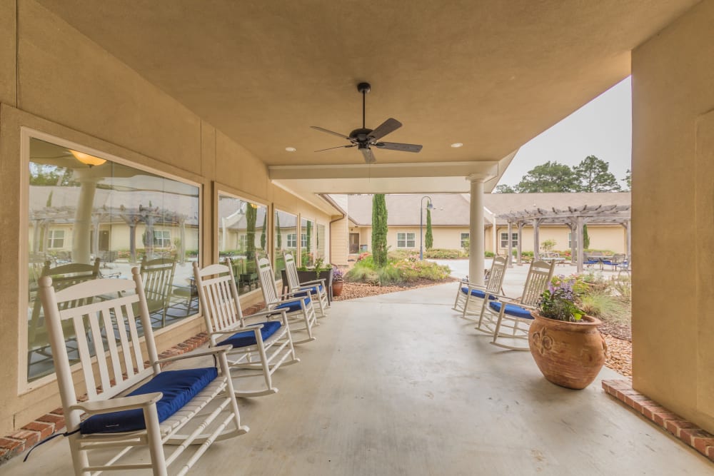 Covered outdoor seating at Cedar Crest Memory Care in Lafayette, Louisiana
