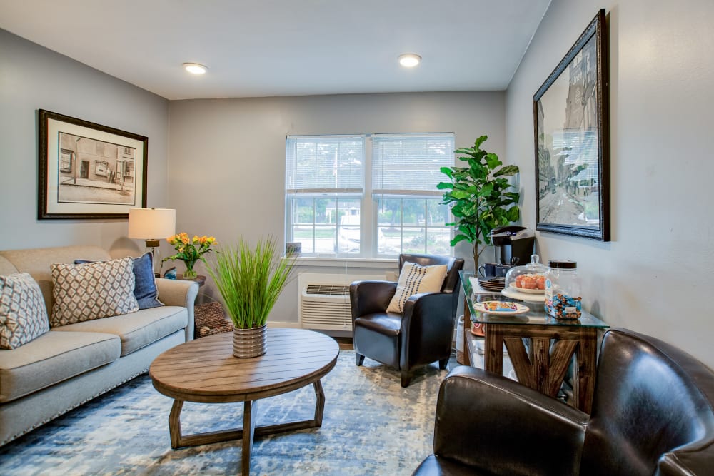 A spacious living room with a large window at Wood Haven in Tewksbury, Massachusetts