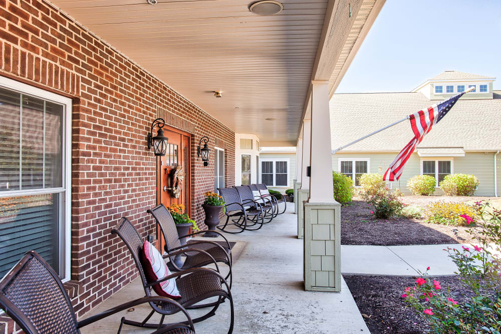 Patio with an American flag at Landings of Huber Heights in Huber Heights, Ohio