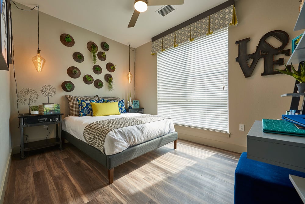 Cozy master bedroom at Encore Evans Station in Denver, Colorado