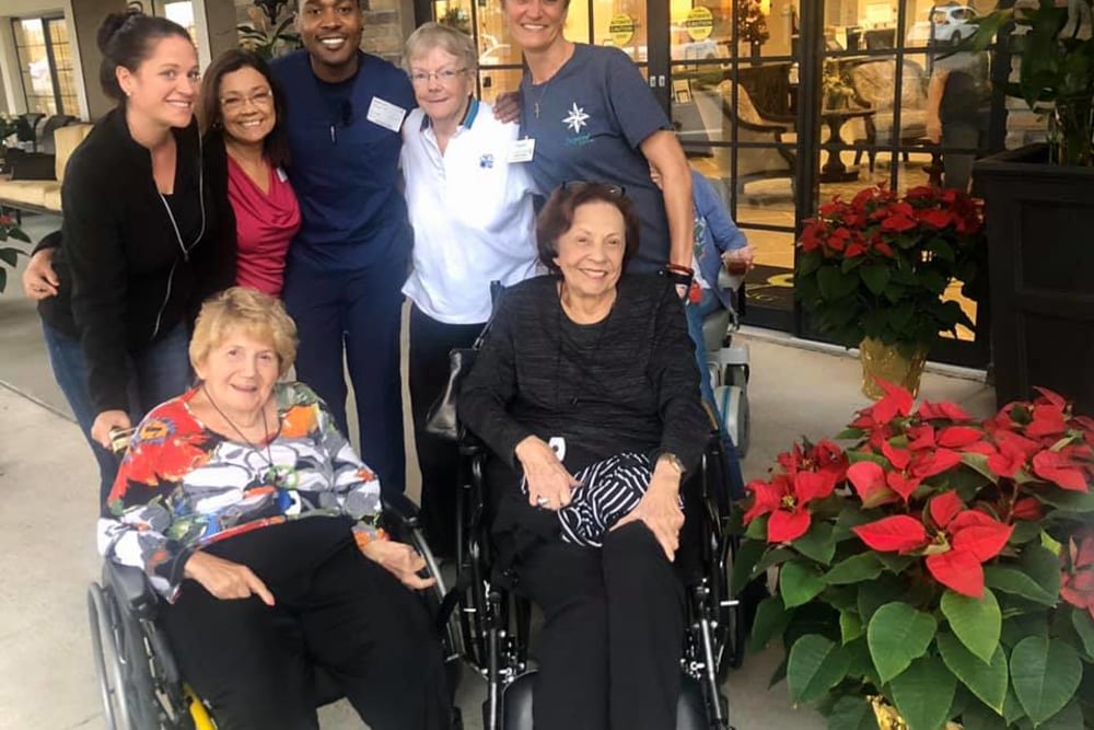 Residents and staff pose for a picture near Inspired Living Ocoee in Ocoee, Florida