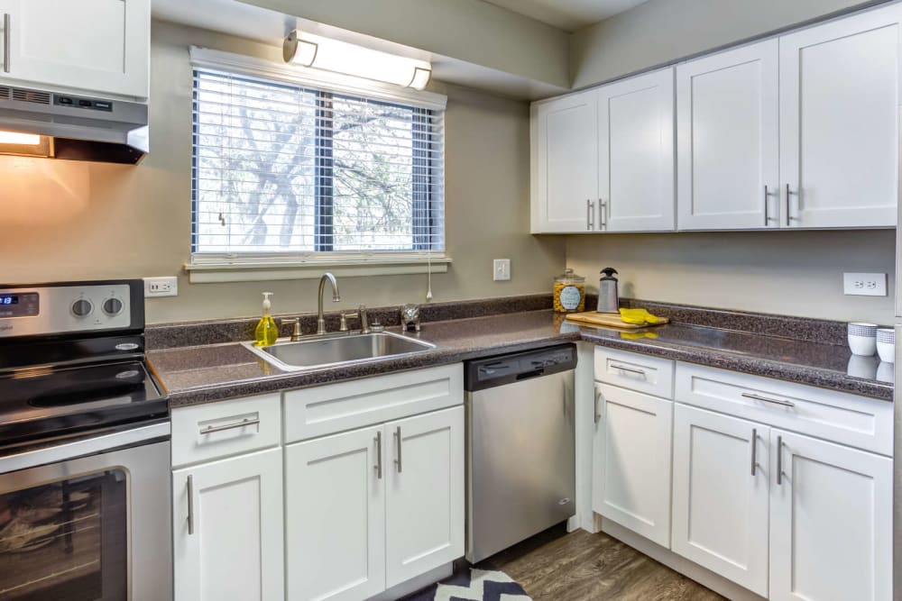 Kitchen with a ceiling fan and back porch access at Lakeside Apartments in Wheaton, Illinois