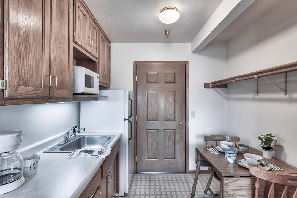 A kitchen with a microwave at Bishop's Court in Allouez, Wisconsin