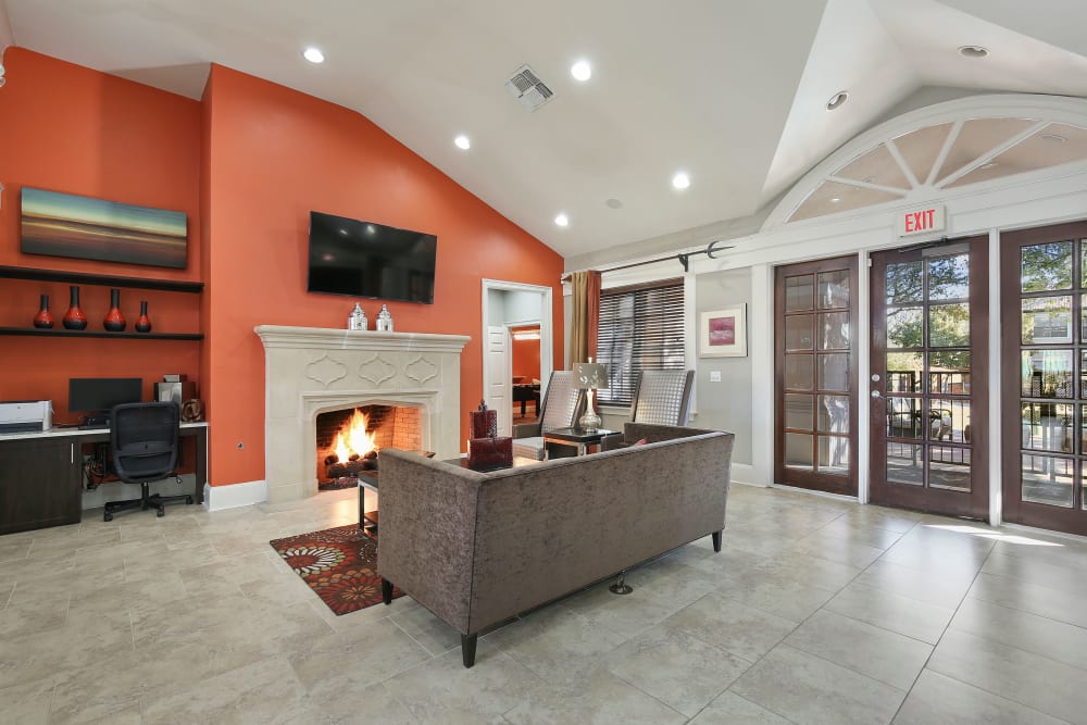 Clubhouse with a fireplace at The Lyndon in Irving, Texas