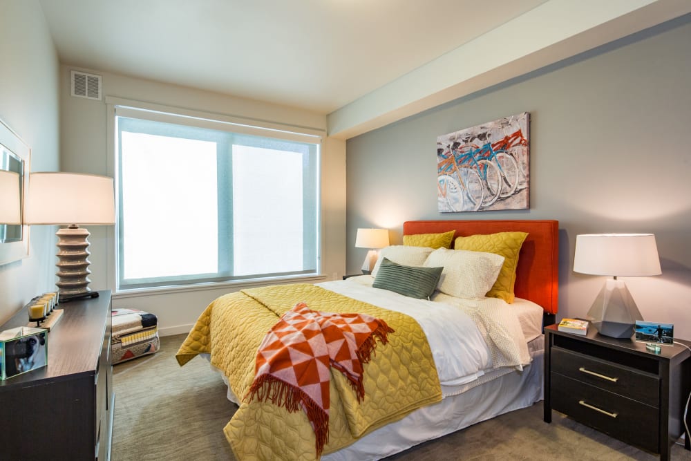 Well-furnished master bedroom in a model home at EVIVA Midtown in Sacramento, California
