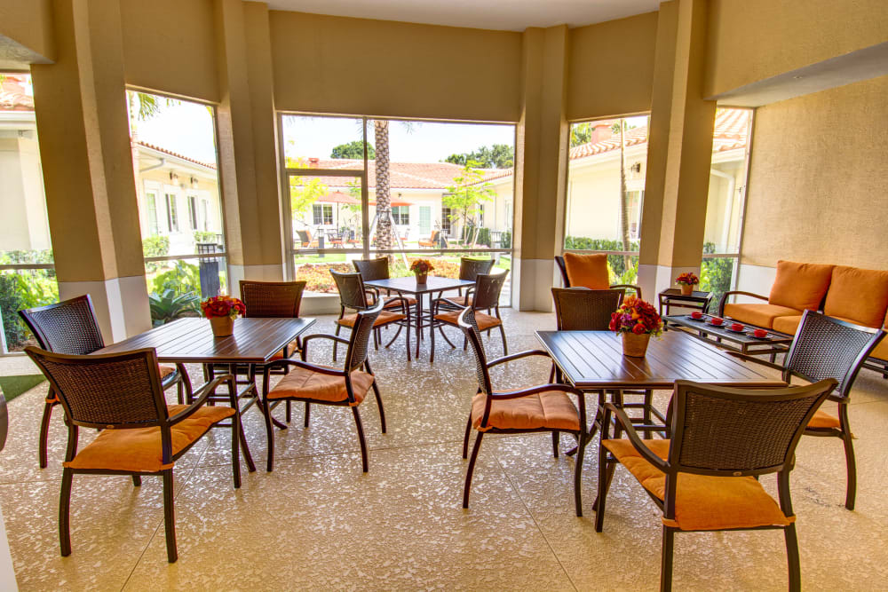 Dining hall with large windows at The Meridian at Boca Raton in Boca Raton, Florida
