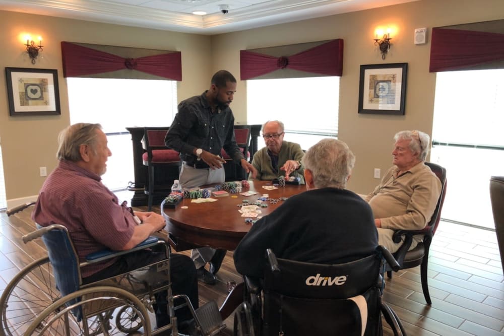 Residents playing cards at Inspired Living Alpharetta in Alpharetta, Georgia. 