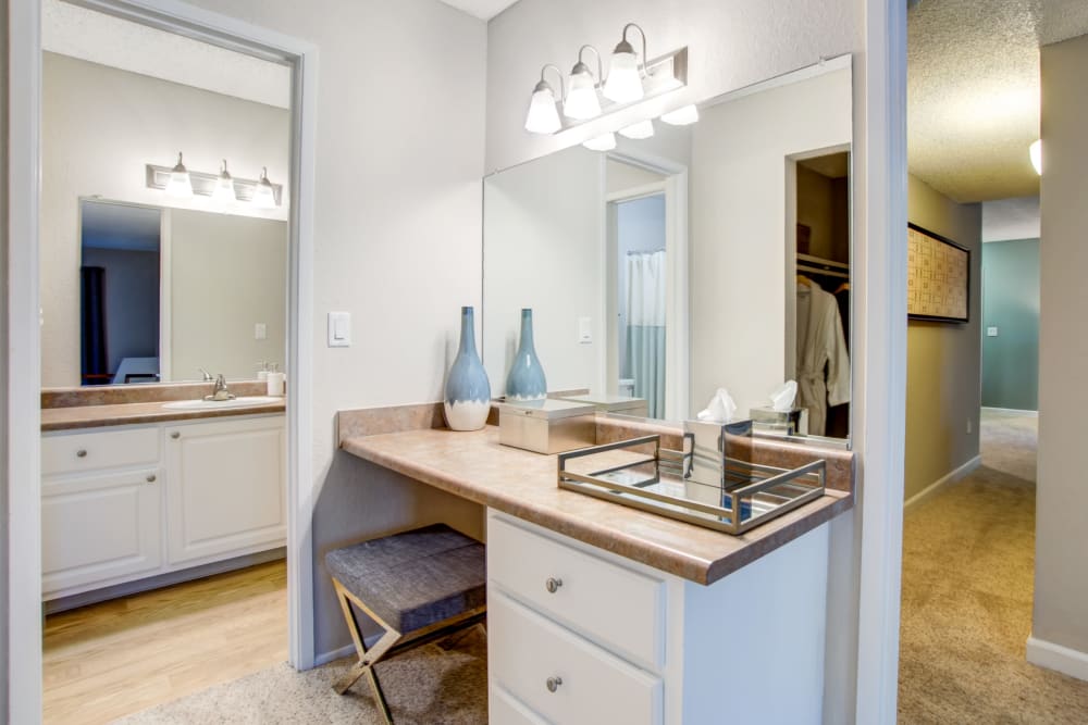 Large master bathroom with a makeup station in a model home at Waterstone Fremont in Fremont, California