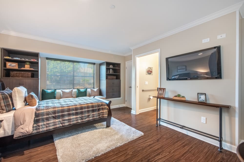 Studio apartment with a tv and a large window at Regency Palms Oxnard in Oxnard, California