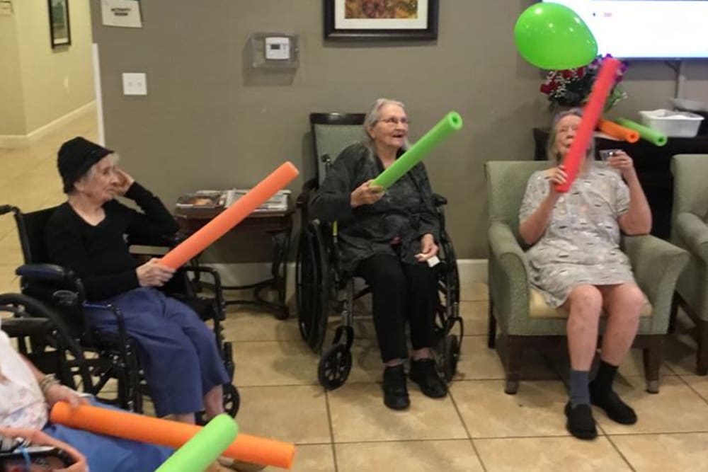 Residents playing a game at Inspired Living Hidden Lakes in Bradenton, Florida