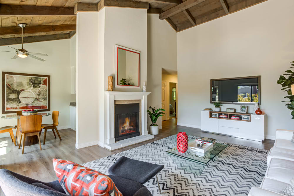 Living room model with red accents at Glenbrook Apartments in Cupertino, California