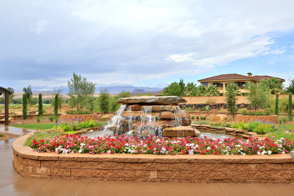 Beautiful flowers and a flowing fountain at The Retreat at Sunbrook in St. George, Utah