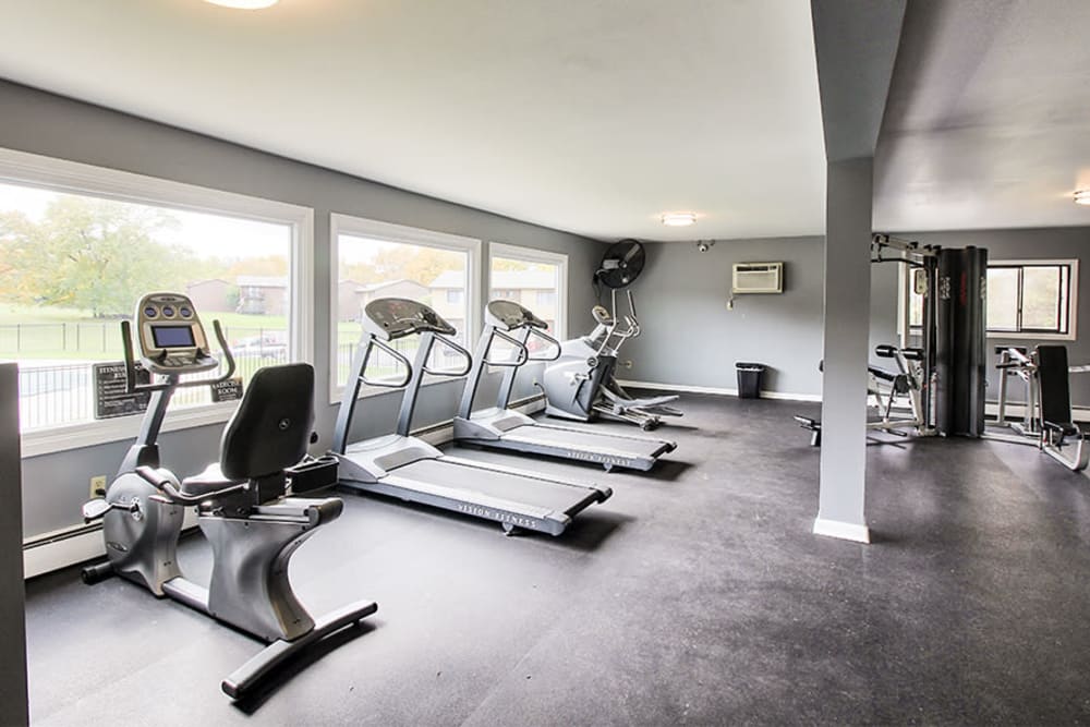 Modern fitness center at High Acres Apartments & Townhomes in Syracuse, New York