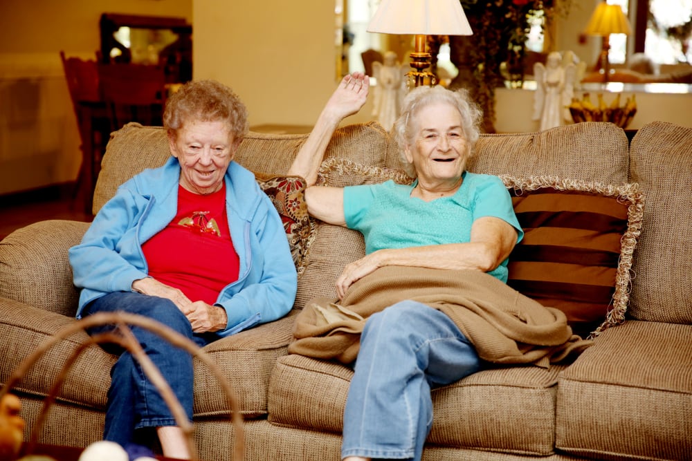 Two residents hanging out on a couch at Providence Assisted Living in Grenada, Mississippi. 