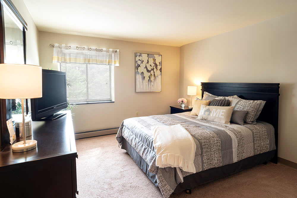 Cozy bedroom at Maiden Bridge & Canongate Apartments in Pittsburgh, Pennsylvania