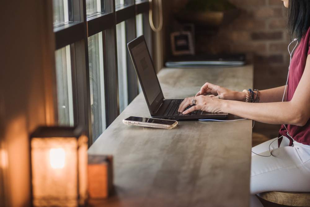 Resident working on a laptop in the co-working space at Springfield Apartments in Murfreesboro, Tennessee