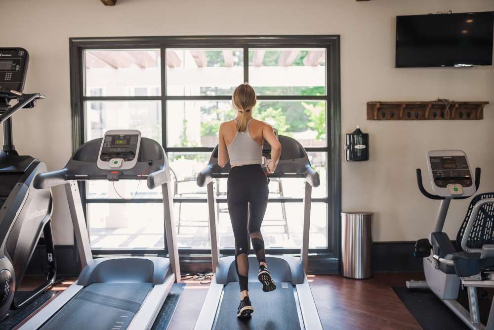 Resident running on a treadmill in the fitness center at Springfield Apartments in Murfreesboro, Tennessee