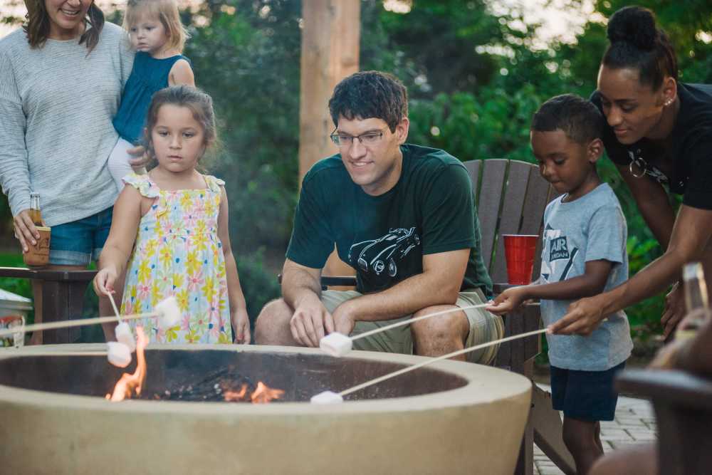 Family roasting marshmallows at the fire pit at Springfield Apartments in Murfreesboro, Tennessee