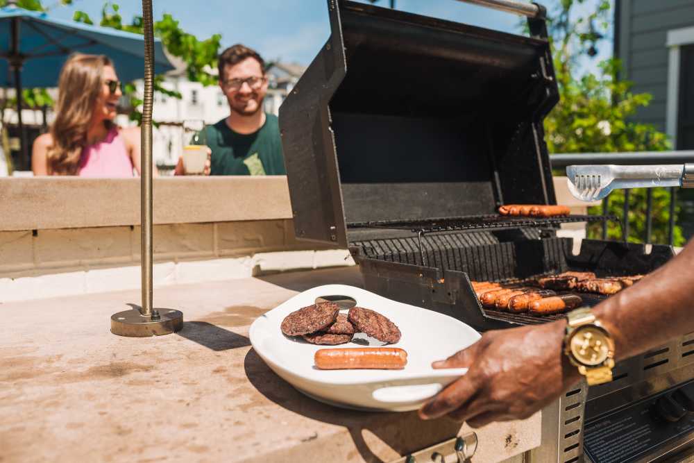 Residents grilling at the outdoor barbecue area at Springfield Apartments in Murfreesboro, Tennessee