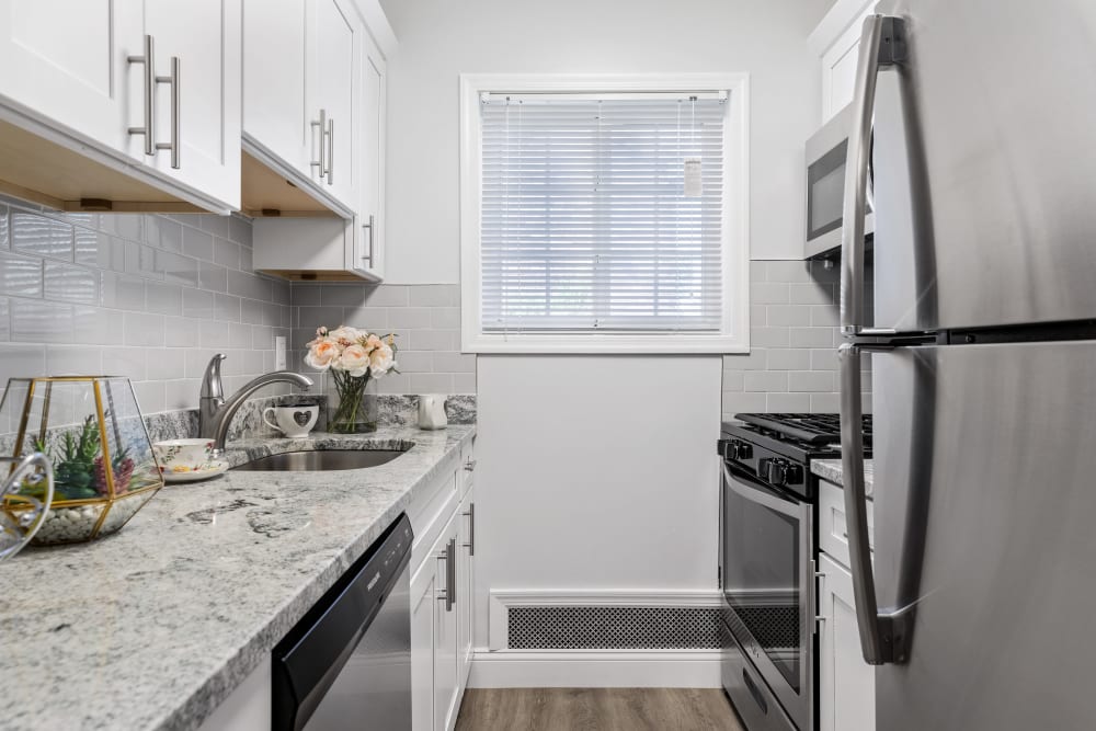 Kitchen with a window at Eagle Rock Apartments at Nesconset in Nesconset, New York
