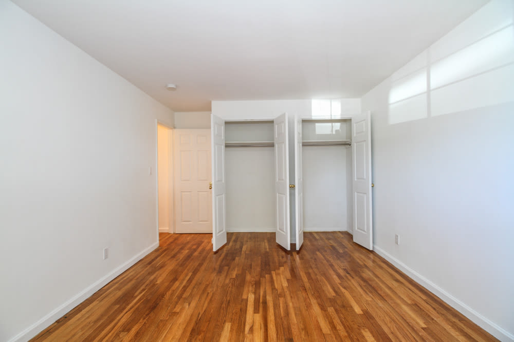 Cozy bedroom at Eagle Rock Apartments at Carle Place in Carle Place, New York