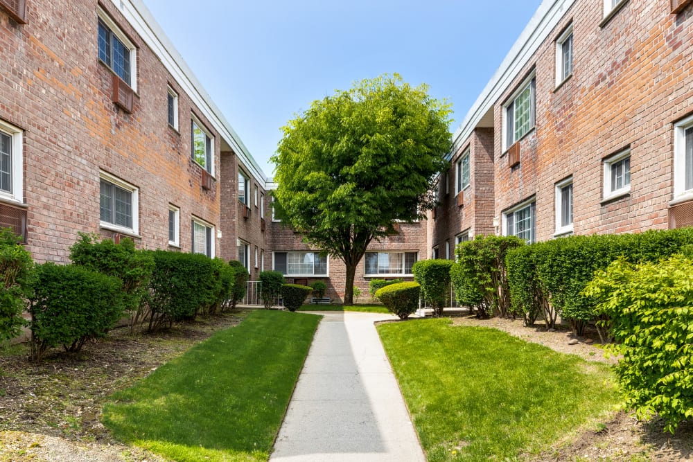 Walkways between buildings at Eagle Rock Apartments at Carle Place in Carle Place, New York
