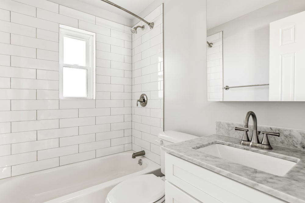 Clean, bright bathroom at Eagle Rock Apartments at Huntington Station in Huntington Station, New York