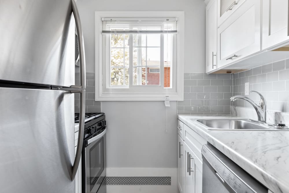Kitchen with stainless steel appliances at Eagle Rock Apartments at Mineola in Mineola, New York