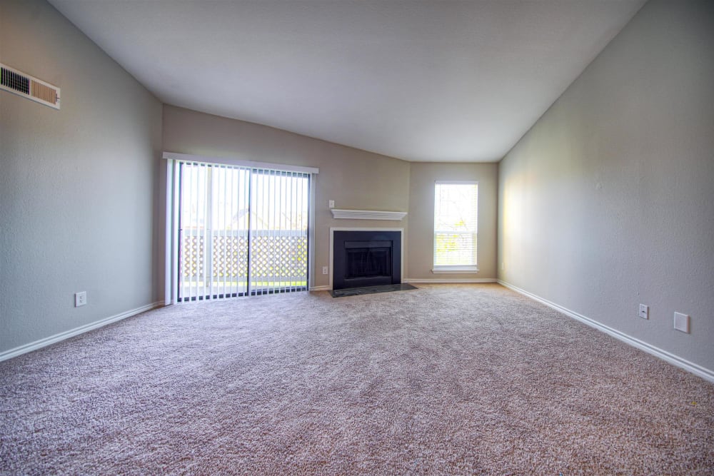 Living room with a fireplace at Hampton Point Apartment Homes in Silver Spring, Maryland