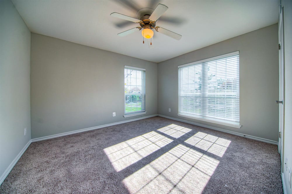 Bedroom with a ceiling fan at Hampton Point Apartment Homesin Silver Spring, Maryland