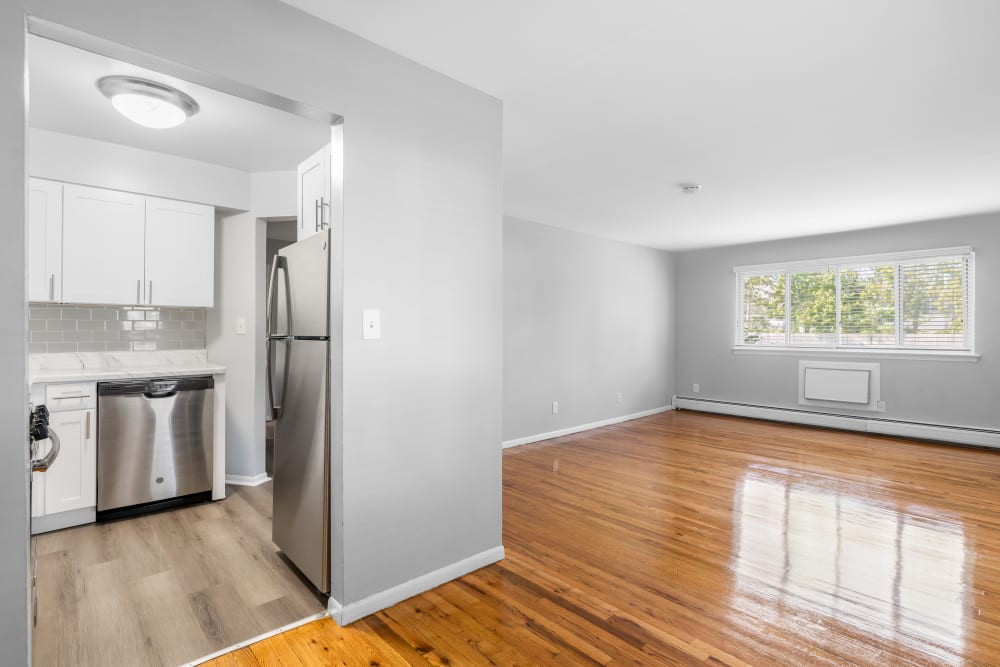 Modern finishes include stainless steel appliances and polished hardwood floors at Mid Island Apartments in Bay Shore, New York
