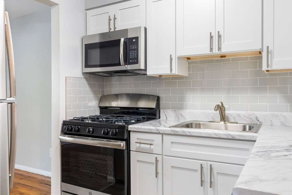 Bright white kitchens at Mid Island Apartments in Bay Shore, New York