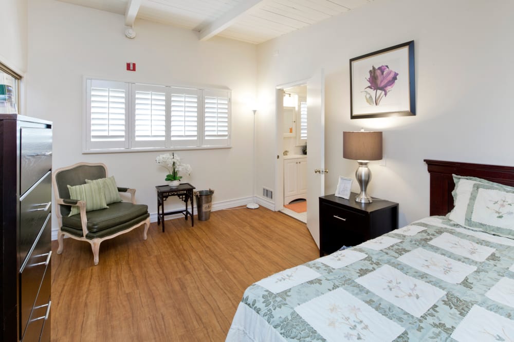 Model bedroom with queen size bed at The Meridian At Bella Mar