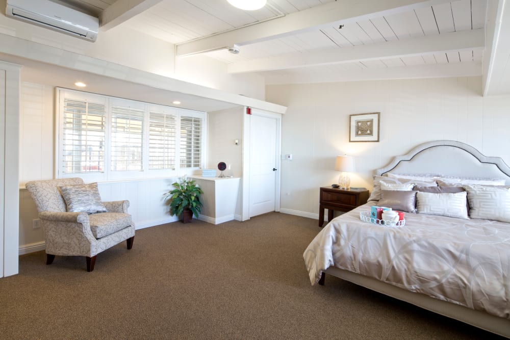 Model bedroom with queen size bed at The Meridian At Bella Mar