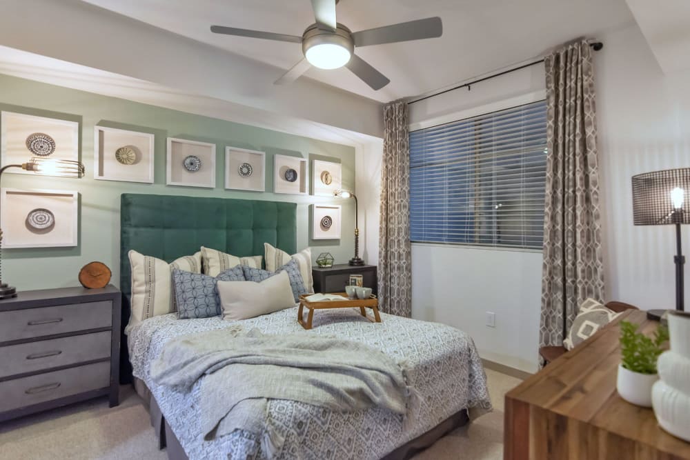 Large primary bedroom with beautiful furnishings in a model home at Arista at Ocotillo in Chandler, Arizona