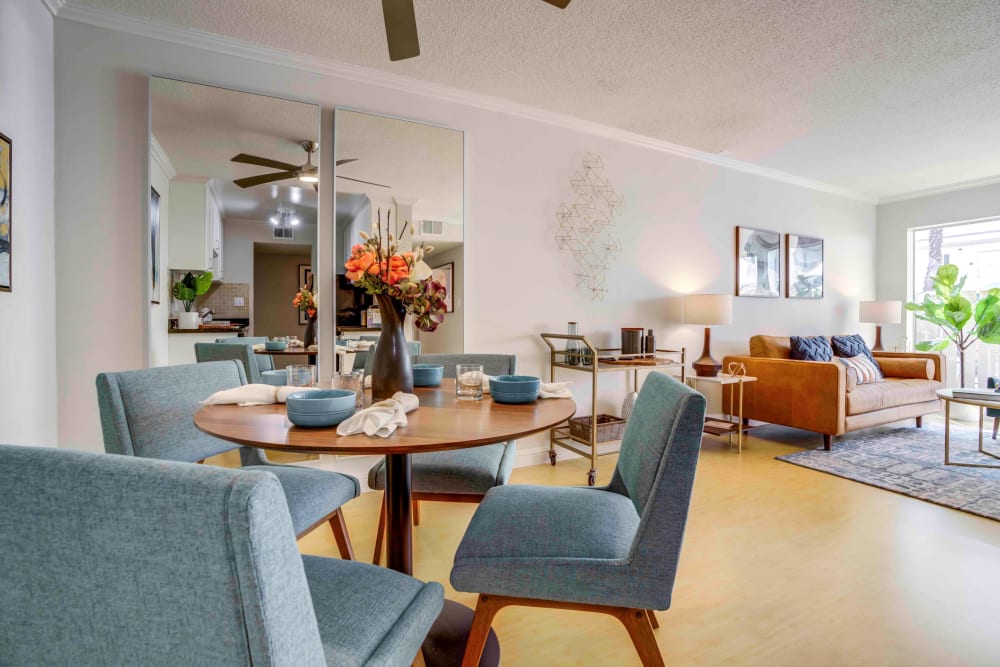 Open-concept floor plan with well-decorated living and dining areas in a model home at Sofi Redwood Park in Redwood City, California