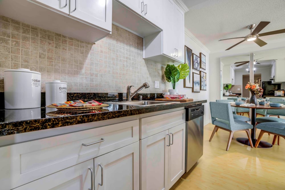 Modern kitchen with white cabinets and modern appliances at Sofi Redwood Park in Redwood City, California