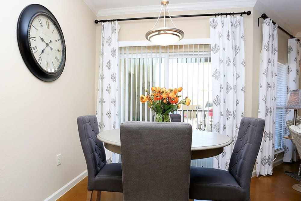 Resident dining room with wood-style flooring at Trails at Lake Houston in Houston, Texas