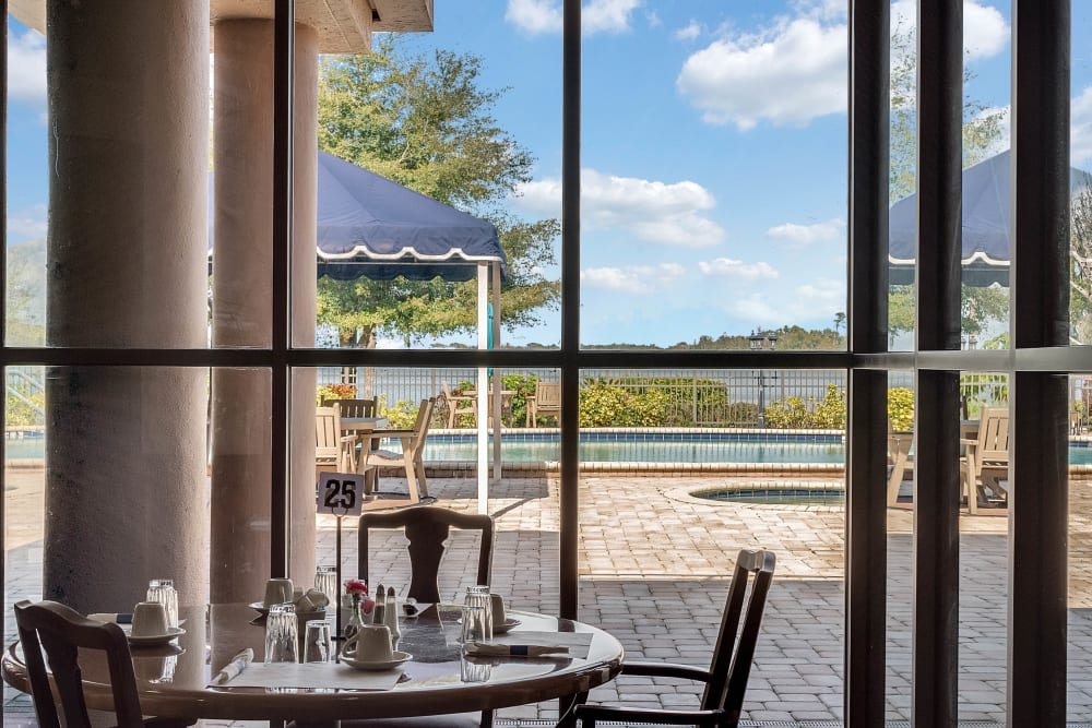 Dining area with view of lake at Spring Haven in Winter Haven, Florida