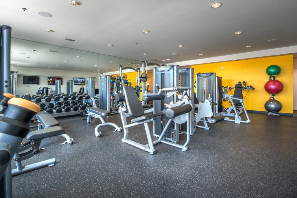 Well-equipped onsite fitness center at Olympus at Ross in Dallas, Texas
