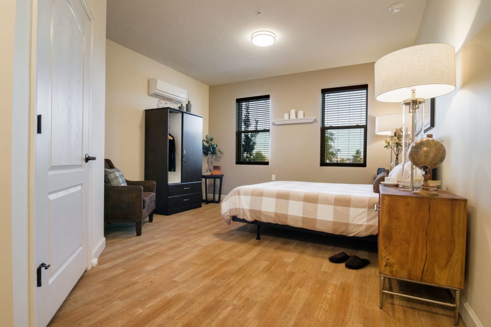 Spacious resident bedroom at CERTUS Premier Memory Care Living in Vero Beach, Florida. 